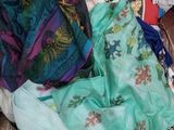 a cardboard box filled with clothes and other items