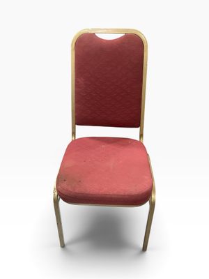 a red chair with a gold frame and red upholstered seat