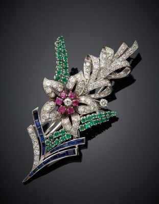 a diamond, emerald and sapphire flower broochle