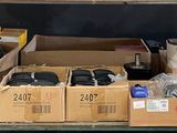 many boxes of electronics on a shelf in a room