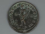an old coin with the image of a man holding a sword on it