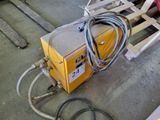 a machine that is sitting on a pallet in the garage