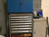 a tool cabinet with tools in it in a garage