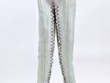 pair of white leather boots with zippers on each side