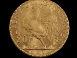 an image of a gold coin with a rooster on it