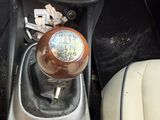 a car dashboard with a clock on the center console