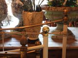 two vases that are sitting on a table in a room