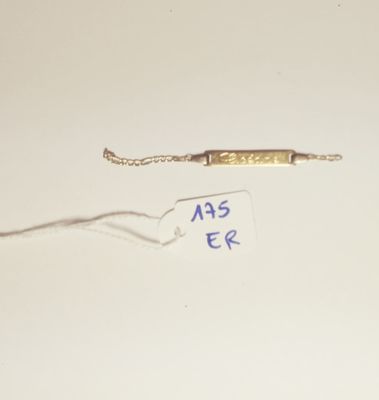 a small piece of metal with a tag attached to it