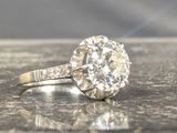 a diamond ring sitting on top of a table