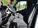 a view of the inside of a vehicle with the driver ' s seat down