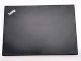 a black laptop with a sticker on it