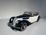 an image of a black and white car on a white surface