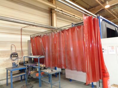 a picture of a room with a lot of red curtains