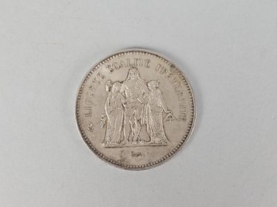 the coin is sitting on a white surface with a white background