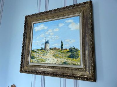 a picture of a painting hanging on the wall of a room
