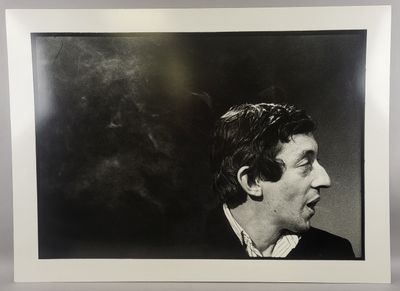 black and white photograph of a man with a cigarette in his mouth