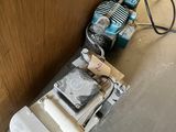 an image of a room that has a bunch of tools on the floor