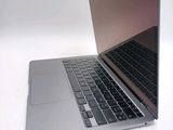 a close up of a laptop computer on a white surface