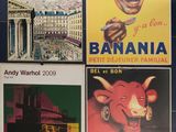 four vintage french travel posters on a wall in a bathroom
