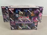 two packs of yu - gi - oh trading cards are sitting on a table