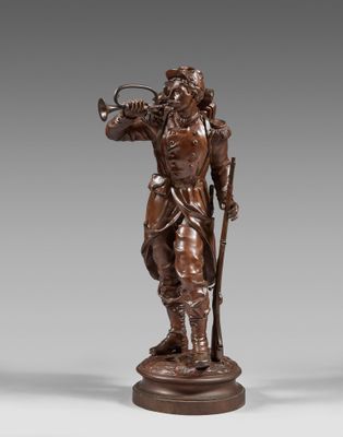a bronze statue of a man with a trumpet on a pedestal
