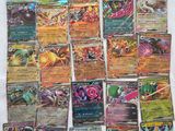 a bunch of pokemon cards sitting on top of a table