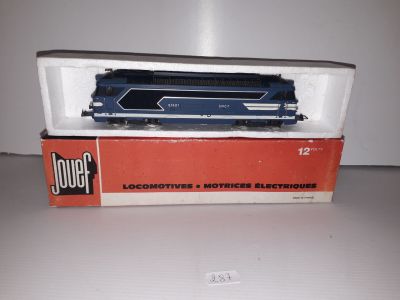 a box with a train on top of it on a table