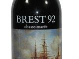 the bottle of wine has a picture of a ship on it