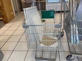 a shopping cart that is sitting in the middle of the floor