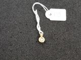 a close up of a tag on a black surface with a white tag