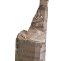 a cardboard chair that has been wrapped up and is ready to be shipped