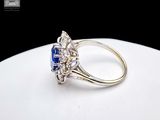an image of a diamond and sapphire ring on a white plate