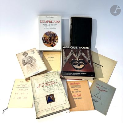 several books are stacked on top of each other on a table