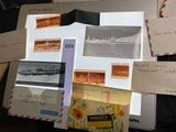 a lot of postcards on a desk with pictures on them