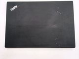 an image of a black mouse pad on a white surface