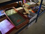 many boxes of books on a table in a room