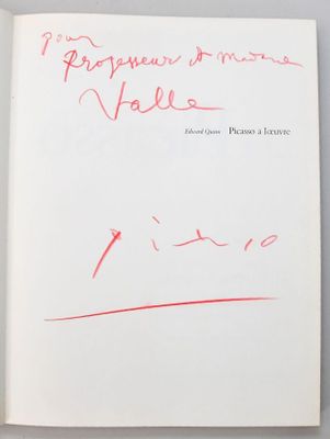 an open book with a handwritten title and a red marker on it