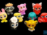 a lot of small toy animals that are on a black background