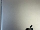 an apple logo on the back of a silver ipad