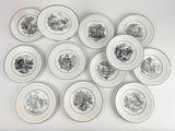 many plates with different designs on them on a white surface