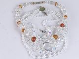 beaded necklace with orange, white and clear beads and a starfish charm