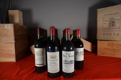 several bottles of wine are lined up on a red table cloth