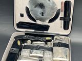 an open suitcase with tools in it on a table