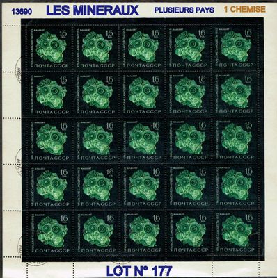 the stamp shows a lot of green clovers on a black background