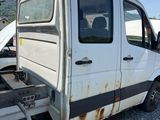 a white van that is parked on the side of the road