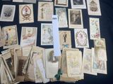 a lot of old postcards on a black table