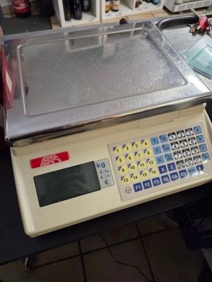 a scale that is sitting on a table in a room