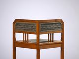 an image of a wooden bench with a wicker seat on it