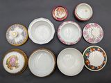 many different types of plates and bowls on the table