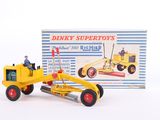 a yellow toy bulldozer with a man on top of it